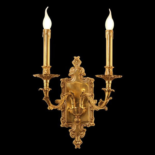 Detailed side angle of the French wall sconce showcasing its ornate brass scrollwork and glowing candle bulbs.