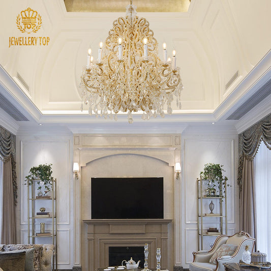 JEWELLERY TOP's gorgeous brass chandelier in a living room with fireplace and mint wall.