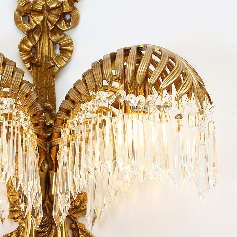 Extreme close-up of a single brass palm leaf, showcasing its intricate surface texture and vein detailing.
