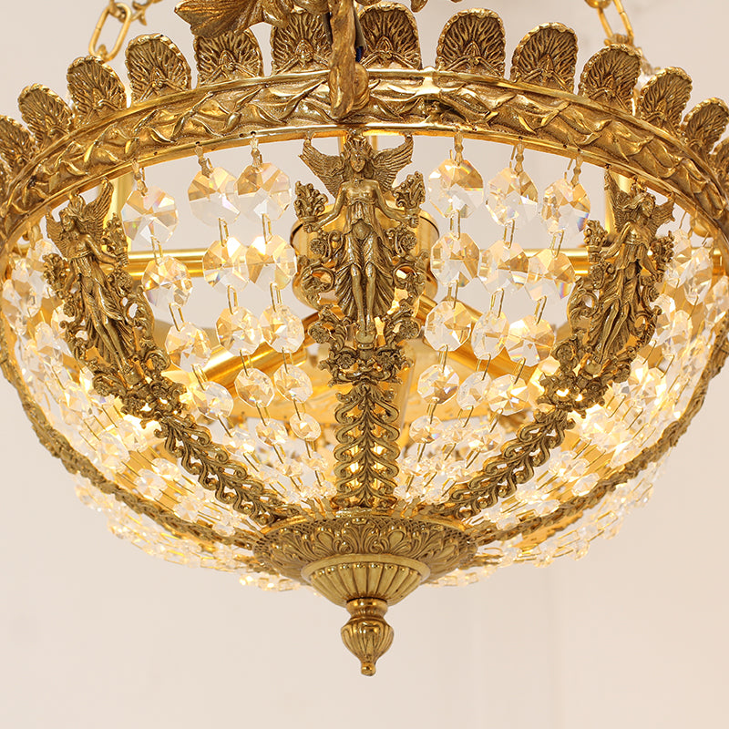 Close-up detail of a brass shell motif, nymph sculpture, and crystal fringe on the chandelier.