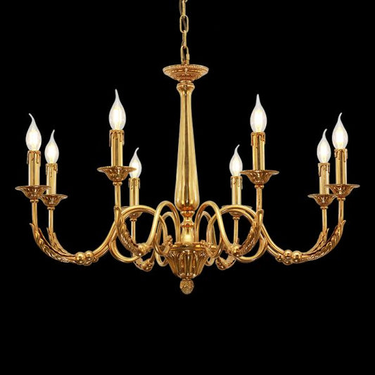Lit luxury brass chandelier as a living room centerpiece, casting a warm glow.