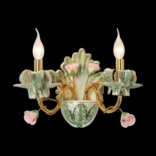 The luxury ceramic wall lamp installed on a white wall, emitting a warm glow beside a decorative mirror.
