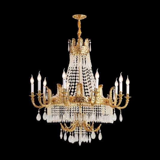 Front view of a golden antique brass chandelier with crystal cascades and candle bulbs.