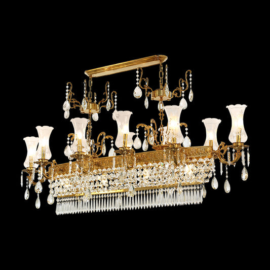 A golden classical brass chandelier with crystal drops and glass shades, isolated on black.