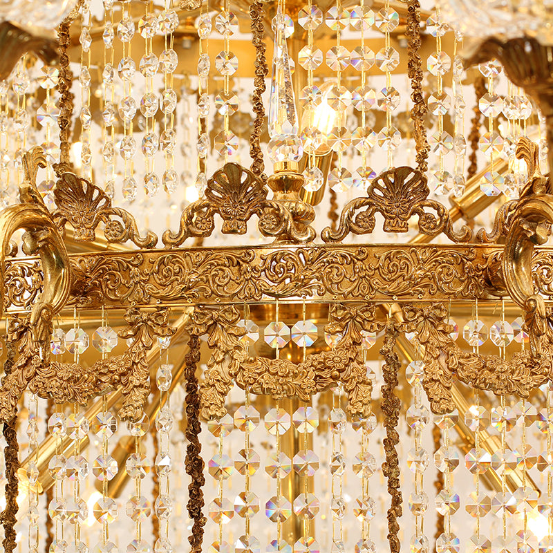 Extreme detail shot of engraved brass scrollwork and hanging K9 crystal bead strings.
