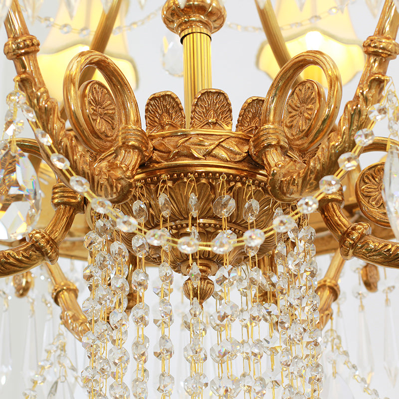 Detailed perspective of a French brass chandelier's central structure and layered crystal fringe.