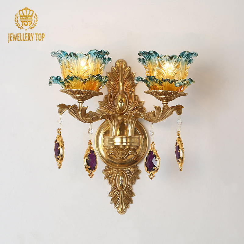 JEWELLERY TOP Fleur de Lumière brass wall sconce with blue-green ombré glass flower shades and amethyst crystals.
