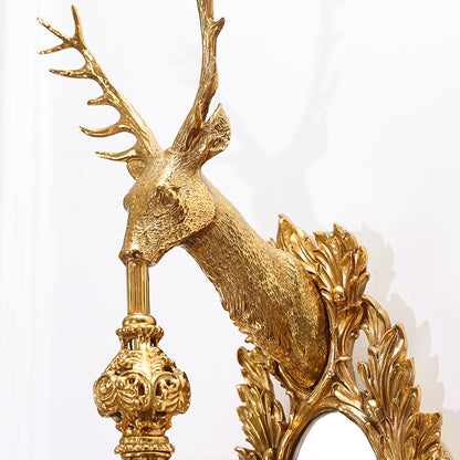 Extreme close-up macro detail of the stag’s sculpted face, textured antlers, and polished brass finish.