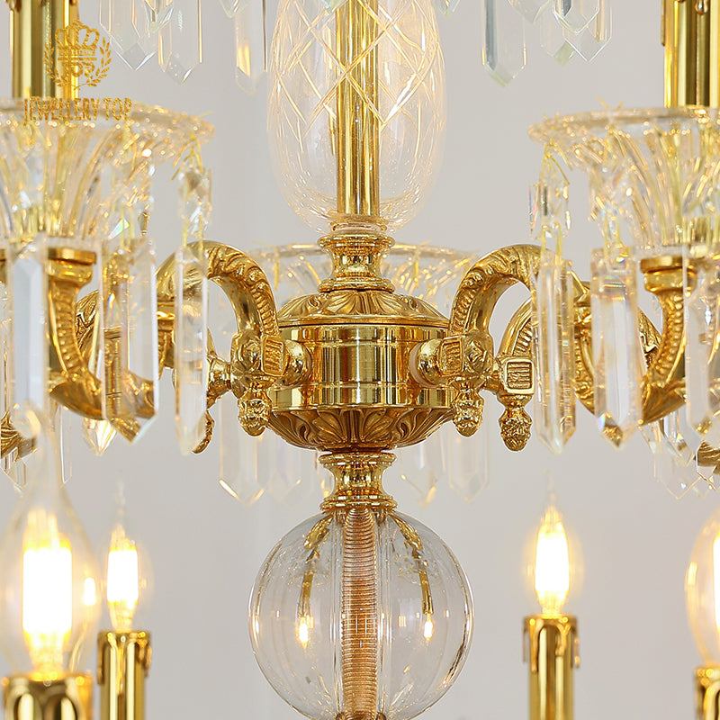 Extreme detail shot focusing on the candle-shaped filament bulbs and the decorative brass canopy at the top.