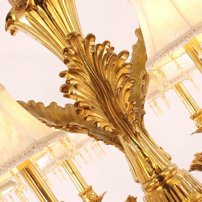 Macro close-up of the finely detailed metal leaves and the textured vine patterns on the golden frame.