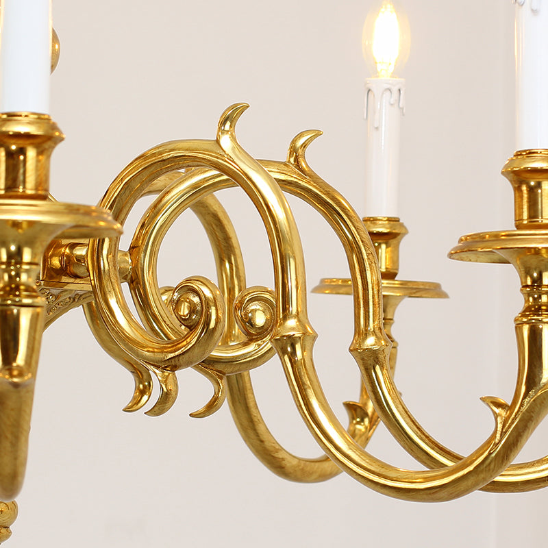Macro close-up of the finely detailed golden winged horse motif and the textured brass scrollwork.