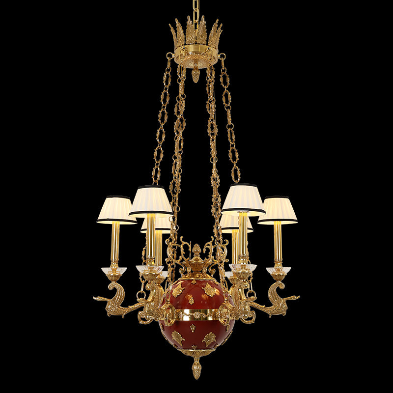 Top view of the Grenade Impériale brass chandelier with crown canopy, chains, and red sphere.