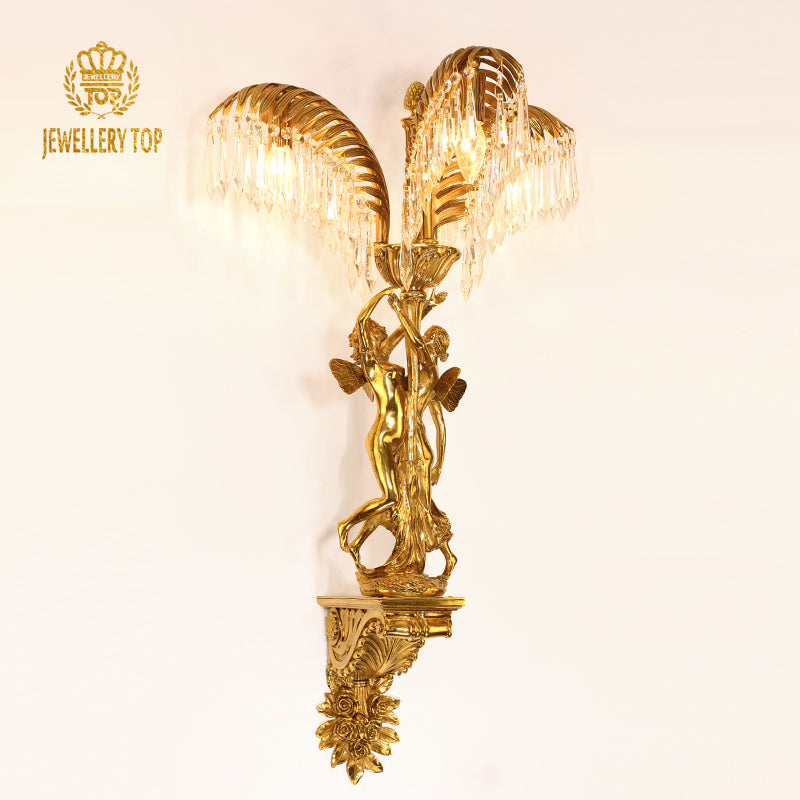 JEWELLERY TOP branded angel wall light, showcasing golden palm leaves, cherub figures, and hanging crystals on white.