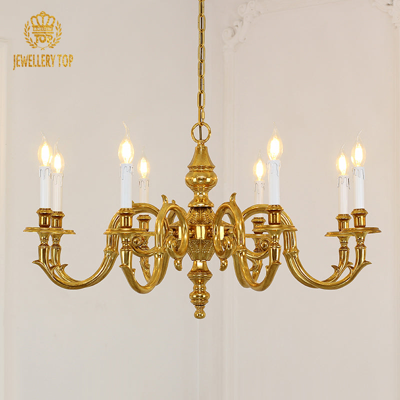 A luxury decorative chandelier installed in a formal dining room with a dark wood table and classic paneled walls.