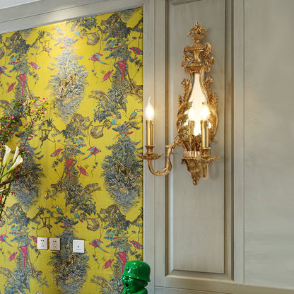 The French wall sconce with mirror installed on a light wood panel wall, complemented by decorative wallpaper and art.