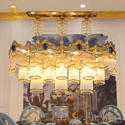 JEWELLERY TOP brand's luxury crystal chandelier highlighting the blue sapphire-inspired crystal accents and intricate gold scrollwork.