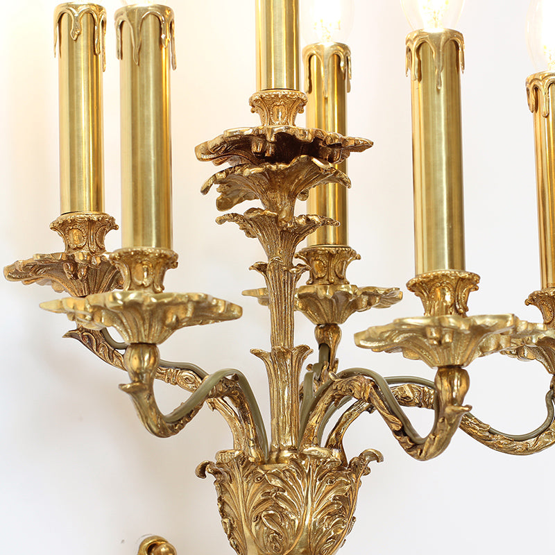 Detailed macro shot of the sconce’s central column, highlighting the complex floral engravings and polished copper finish.