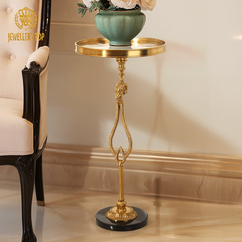Lifestyle image of The Chrysomallos table styled with a brass flower vase in a classic interior by Jewellery Top.