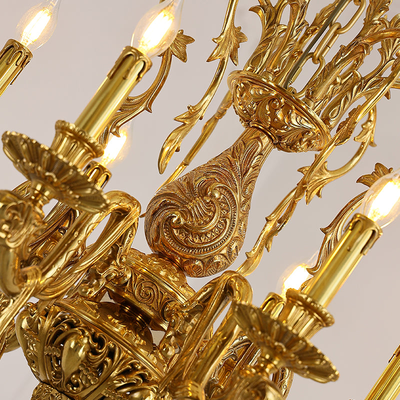 Macro close-up of the finely sculpted golden acanthus leaves and the textured candle drip details.