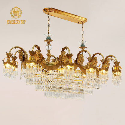 JEWELLERY TOP brand's crystal decorative chandelier featuring detailed golden cherub sculptures and ornate metalwork.