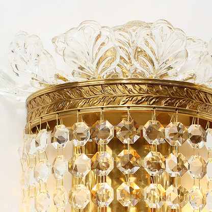 Detailed shot of the sconce’s ornate brass and white porcelain floral decoration, highlighting its craftsmanship.