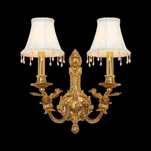 Front view of the Ailes de Dentelle golden brass wall sconce with two white fabric shades and crystal bead fringes.