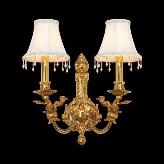 Front view of the Ailes de Dentelle golden brass wall sconce with two white fabric shades and crystal bead fringes.