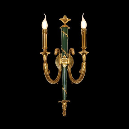 Front view of the JEWELLERY TOP Laurier Triomphe brass wall lamp with jade green column and golden laurel wreath.