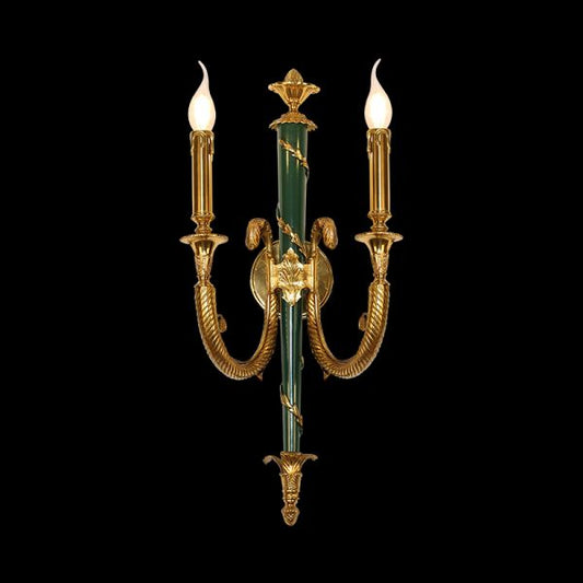 Front view of the JEWELLERY TOP Laurier Triomphe brass wall lamp with jade green column and golden laurel wreath.