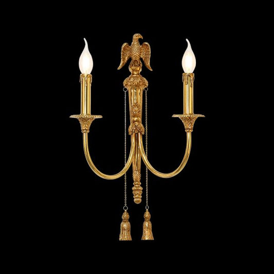 Close-up front view of the Aigle Impérial brass wall sconce with a detailed eagle sculpture and crystal fringes on black background, JEWELLERY TOP.
