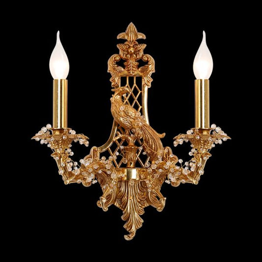 Front view of the Oiseau d'Or golden brass wall sconce with a central phoenix bird and crystal decorations.