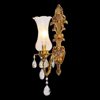 Detailed macro shot of the flared clear glass lampshade and the sparkling teardrop crystal fringe.