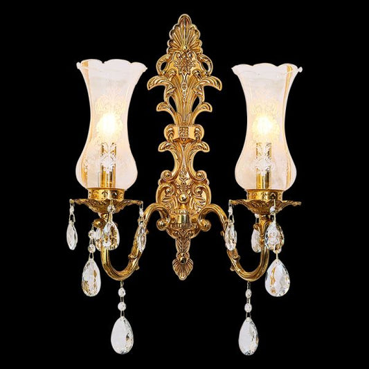Front view of the JEWELLERY TOP Royal Cornet dual-light brass sconce with trumpet glass shades and crystal drops.