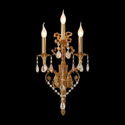 Macro shot of the ornate brass acanthus leaf carvings and suspended crystal droplets on the sconce.