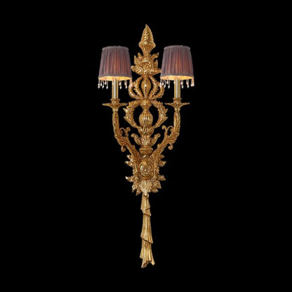 Front view of the Baroque Soleil golden brass wall sconce with two fabric shades and crystal fringes on black.