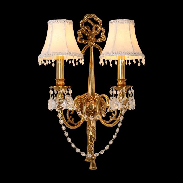 Close-up front view of the Noeud de Dentelle brass wall sconce with lace-trimmed shades on a black background, JEWELLERY TOP.