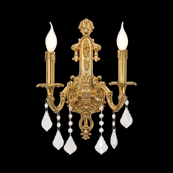 Château de Lumière Brass Wall Sconce with crystal droplets and candle bulbs on a dark background.