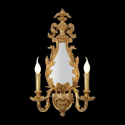 Front product shot of JEWELLERY TOP Belle Époque brass wall lamp with central mirror and two candle lights on black.