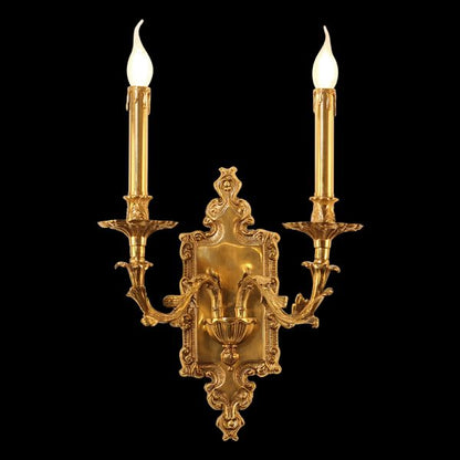 Detailed side angle of the French wall sconce showcasing its ornate brass scrollwork and glowing candle bulbs.