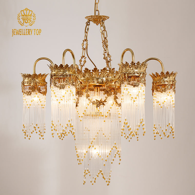 JEWELLERY TOP brand's hotel chandelier with intricate crest carvings and cascading crystals.