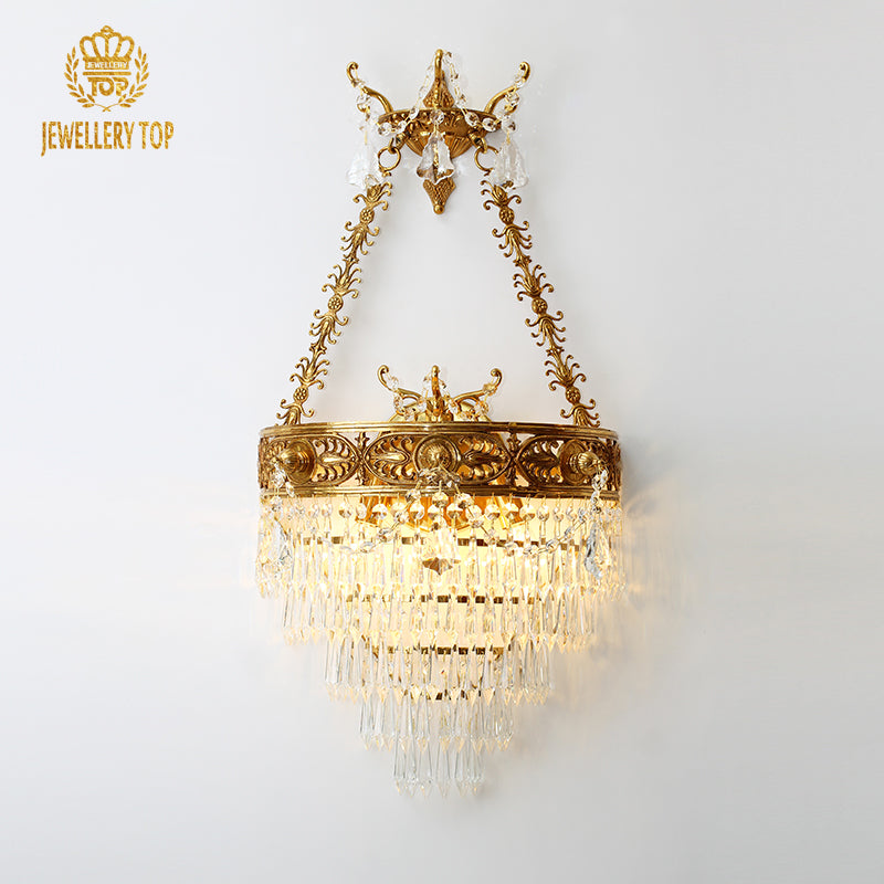 Detailed product shot of the luxury crystal lampshade wall sconce, showcasing its elegant form and sparkling details.