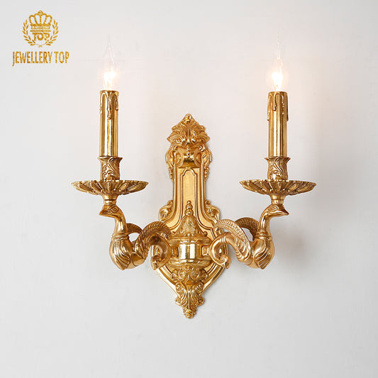 Front view of the Poseidon's Chariot golden brass wall sconce with seahorse arms and avian sculpture, brand JEWELLERY TOP.