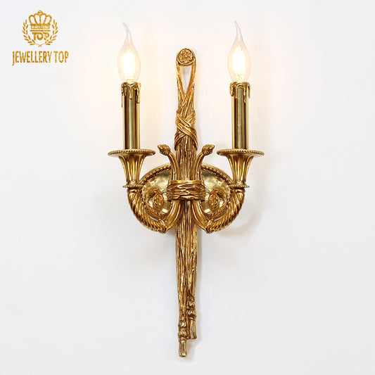 JEWELLERY TOP Golden Rococo Scroll Brass Wall Lamp with symmetrical acanthus leaves and vintage candle bulbs on a white wall.