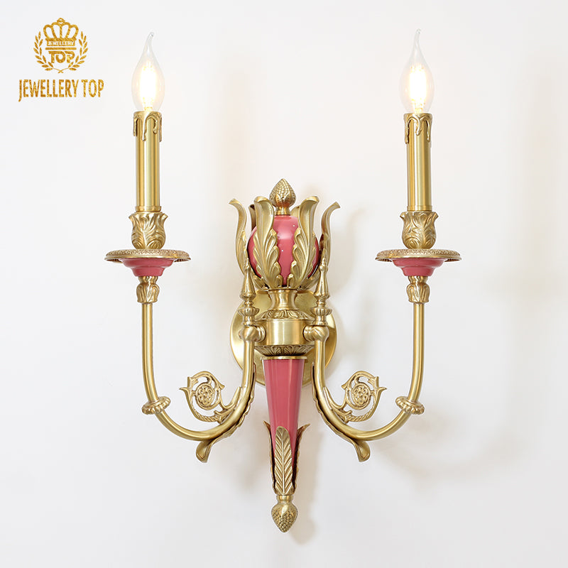 JEWELLERY TOP Fleur de Sève brass wall sconce with pink flower and teal leaves on a white background.