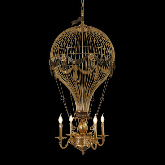Close-up of Verne's Voyage hot-air balloon brass chandelier with CONCHERO detail, black background.