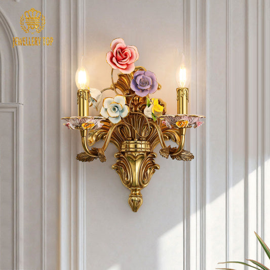 Front close-up of the French art decorative wall sconce showcasing pink, purple, and yellow hand-painted ceramic blossoms.