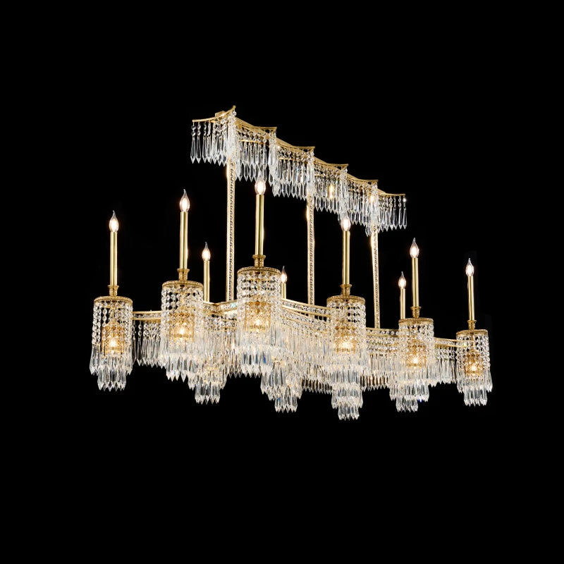 Luxury brass chandelier with multi-tiered crystal decorations and candle bulbs, black background.