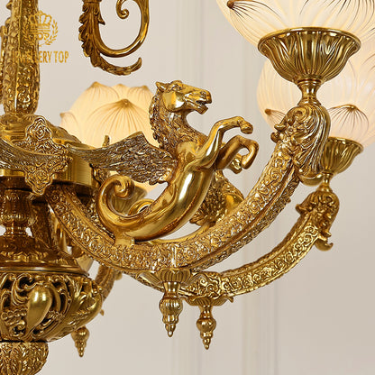 Macro close-up of the finely detailed golden winged horse motif and the textured brass acanthus leaves.