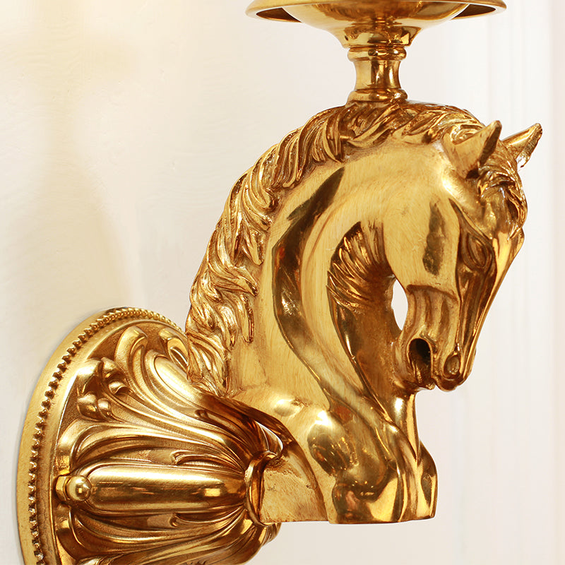 Extreme macro close-up of the horse head sculpture, detailing the textured mane, facial features, and polished brass finish.