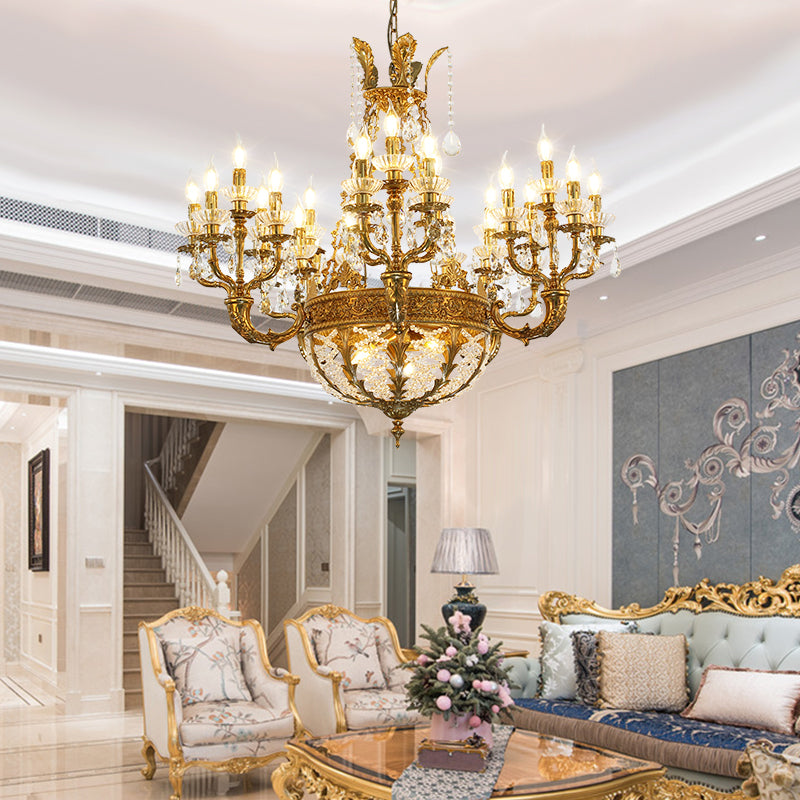 JEWELLERY TOP brand's luxury crystal chandelier showcasing elaborate scrolling brass arms and tiered crystal drops.